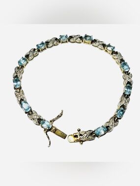 Sterling Silver Swiss Blue Topaz 14 Stone Tennis Bracelet Open Criss Cross X